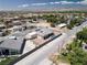 The aerial view shows the desert landscaped home, the pool, and the surrounding neighborhood at 7062 Maverick St, Las Vegas, NV 89131