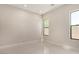 Bright bedroom with white tile flooring featuring modern windows and recessed lighting at 7062 Maverick St, Las Vegas, NV 89131