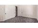 Bedroom featuring sliding closet doors and gray carpeting, offering ample space at 7062 Maverick St, Las Vegas, NV 89131