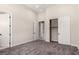 Neutral bedroom with plush carpet, double door closet, and white trim offers a cozy and organized space at 7062 Maverick St, Las Vegas, NV 89131