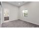 Cozy bedroom with plush carpet and window overlooking neighborhood and attached bathroom at 7062 Maverick St, Las Vegas, NV 89131
