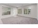 Spacious bonus room featuring large windows, neutral walls, and soft carpet, ideal for relaxation and entertainment at 7062 Maverick St, Las Vegas, NV 89131