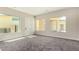 Bonus room with large windows showcasing natural light, soft carpet, and modern design at 7062 Maverick St, Las Vegas, NV 89131