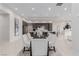 Elegant dining room area with modern table and chairs, flowing into open kitchen space at 7062 Maverick St, Las Vegas, NV 89131