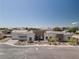 Beautiful single-story home with desert landscaping, three-car garage, and elegant gray and brick accents at 7062 Maverick St, Las Vegas, NV 89131