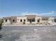 The home's exterior displays modern design elements and desert landscaping for low maintenance at 7062 Maverick St, Las Vegas, NV 89131