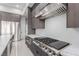 Modern kitchen featuring stainless steel appliances, gas range, and contemporary cabinetry at 7062 Maverick St, Las Vegas, NV 89131
