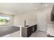 Modern kitchen with marble countertops, stainless steel sink, and gray cabinetry at 7062 Maverick St, Las Vegas, NV 89131