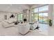 Open-concept living room with fireplace, high ceilings, tile floors, and access to the outdoor pool at 7062 Maverick St, Las Vegas, NV 89131