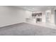 Open living room and kitchenette features a stylish breakfast bar with modern fixtures and appliances at 7062 Maverick St, Las Vegas, NV 89131