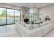 Spacious living room with fireplace, tile flooring, large windows, and views of the backyard pool at 7062 Maverick St, Las Vegas, NV 89131