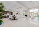 Expansive open-concept living area with modern kitchen, dining area, fireplace, and ample seating at 7062 Maverick St, Las Vegas, NV 89131