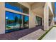 Expansive patio with sliding glass doors offering views of the pristine pool and landscaping at 7062 Maverick St, Las Vegas, NV 89131