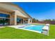Beautiful backyard with a refreshing pool, manicured lawn, and a modern home exterior at 7062 Maverick St, Las Vegas, NV 89131