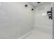 Modern, tiled walk-in shower with dual shower heads, bench, and sleek fixtures at 7062 Maverick St, Las Vegas, NV 89131