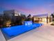 Luxury pool and spa with a modern outdoor kitchen and seating area at 7385 Heron Canyon Ct, Las Vegas, NV 89117