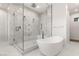 Spa-like bathroom with a large walk-in shower and soaking tub at 7385 Heron Canyon Ct, Las Vegas, NV 89117