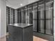 Large walk-in closet with glass doors and custom shelving at 7385 Heron Canyon Ct, Las Vegas, NV 89117