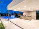 Modern outdoor kitchen and bar area adjacent to the pool at 7385 Heron Canyon Ct, Las Vegas, NV 89117