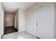 Bright entryway featuring tiled floors, closet, and front door at 5620 Pinecone Pl, Las Vegas, NV 89108