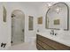 Elegant bathroom with a walk-in shower and a large mirror at 9880 Dorrell Ln, Las Vegas, NV 89149