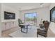 Bright home office features built-in cabinetry and a large window at 9880 Dorrell Ln, Las Vegas, NV 89149