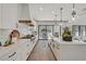 Spacious kitchen boasts modern appliances and opens to a backyard patio at 9880 Dorrell Ln, Las Vegas, NV 89149