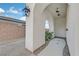 Private outdoor shower with arched entryway and stone pathway at 9880 Dorrell Ln, Las Vegas, NV 89149