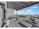 Spacious patio features a pergola, comfortable seating, and city views at 9880 Dorrell Ln, Las Vegas, NV 89149