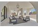 Large covered patio with comfortable seating and outdoor dining area at 9880 Dorrell Ln, Las Vegas, NV 89149
