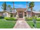 Beautiful single-story home with a tile roof, lush landscaping, and a large driveway at 1813 Skyline Dr, Las Vegas, NV 89117