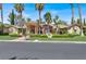 Single-story house with tile roof, columns, and landscaping at 1813 Skyline Dr, Las Vegas, NV 89117