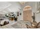 Elegant living room featuring high ceilings, a chandelier, and large double doors at 1813 Skyline Dr, Las Vegas, NV 89117