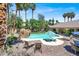 Luxury backyard oasis with a large pool and patio area at 1813 Skyline Dr, Las Vegas, NV 89117