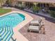 Relaxing pool and patio with lounge chairs and brick pavers at 1813 Skyline Dr, Las Vegas, NV 89117