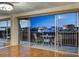 Condo balcony with seating and stunning city views at dusk at 3111 Bel Air Dr # 12C, Las Vegas, NV 89109