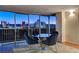 Modern dining area with city views and stylish blue chairs at 3111 Bel Air Dr # 12C, Las Vegas, NV 89109