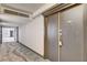 Hallway view towards a door with nice floors and neutral paint colors at 3111 Bel Air Dr # 12C, Las Vegas, NV 89109