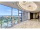 Hallway with views of the city and a decorative ceiling with an ornate chandelier at 3111 Bel Air Dr # 12C, Las Vegas, NV 89109