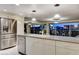 Open kitchen with stainless steel appliances and city view at 3111 Bel Air Dr # 12C, Las Vegas, NV 89109