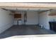 Attached garage with washer, dryer, and ample storage shelving at 4727 Wild Draw Dr, North Las Vegas, NV 89031