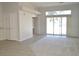 Spacious living room with tile floors and sliding glass doors at 4727 Wild Draw Dr, North Las Vegas, NV 89031