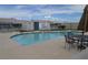 Community pool with patio furniture and surrounding landscaping at 4727 Wild Draw Dr, North Las Vegas, NV 89031