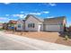 Attractive home showcases a brick driveway leading to a two-car garage under a partly cloudy, vibrant blue sky at 7132 Silver Palace St, Las Vegas, NV 89131