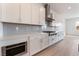 Modern kitchen with stainless steel appliances, gas cooktop, and white cabinetry at 7132 Silver Palace St, Las Vegas, NV 89131