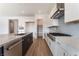 Modern kitchen featuring a stainless steel appliance package, island, and walk-in pantry at 7132 Silver Palace St, Las Vegas, NV 89131