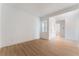 Bright living room with light wood flooring and a large window providing ample natural light at 7132 Silver Palace St, Las Vegas, NV 89131