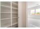 Spacious walk-in pantry features custom built-in shelving for optimal storage and organization solutions at 7132 Silver Palace St, Las Vegas, NV 89131