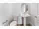 Charming powder room featuring pedestal sink, modern fixtures, and comfortable toilet at 7132 Silver Palace St, Las Vegas, NV 89131