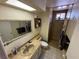 Bathroom with a shower, toilet, and vanity, complete with an inset shower at 611 E Fairway Rd, Henderson, NV 89015